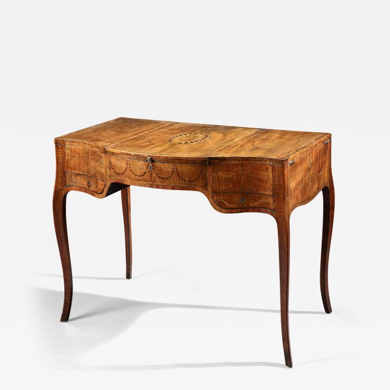 A FINE GEORGE III PERIOD FIDDELBACK SYCAMORE AND MARQUETRY DRESSING TABLE