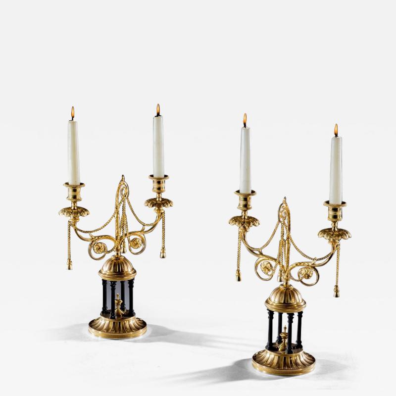 A FINE PAIR OF ORMOLU AND BRONZE TEMPLE CANDELABRA