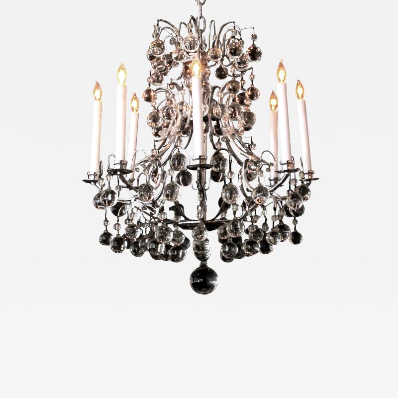 A French 1960s chrome basket form 8 light chandelier with crystal spheres