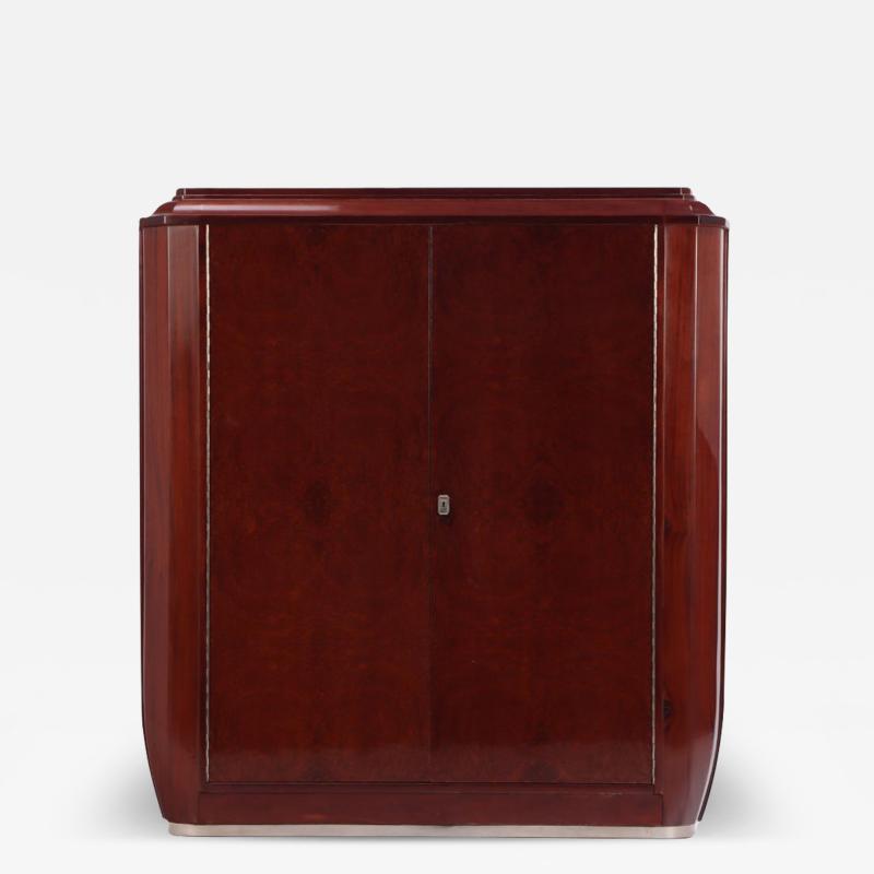 A French Art Deco amboyna wood and mahogany cabinet wardrobe C 1930 