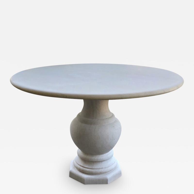 A French Carved Limestone Circular Table on a Baluster form Base