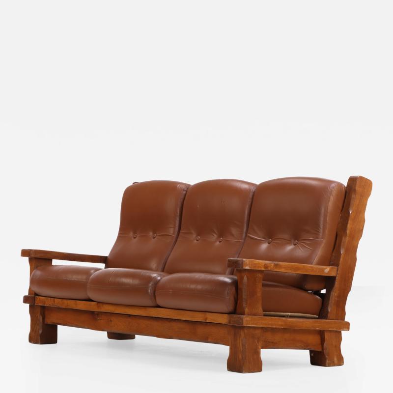 A French Heavy Oak Brutalist style Open Arm Sofa C 1960 