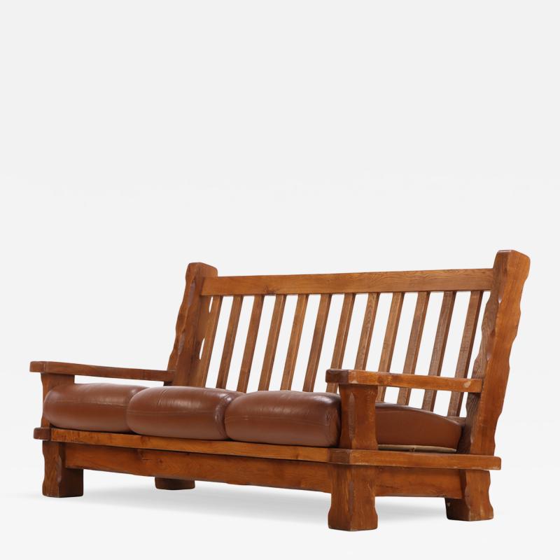 A French Heavy Oak Brutalist style Open Arm Sofa C 1960 