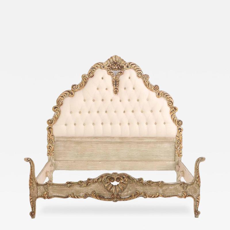 A French Hollywood Regency style painted and gilt carved full size bed C 1940 