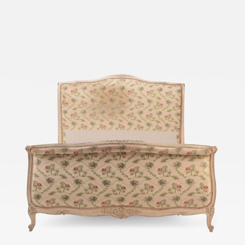 A French Louis XV style Queen size painted and carved bed circa 1950 