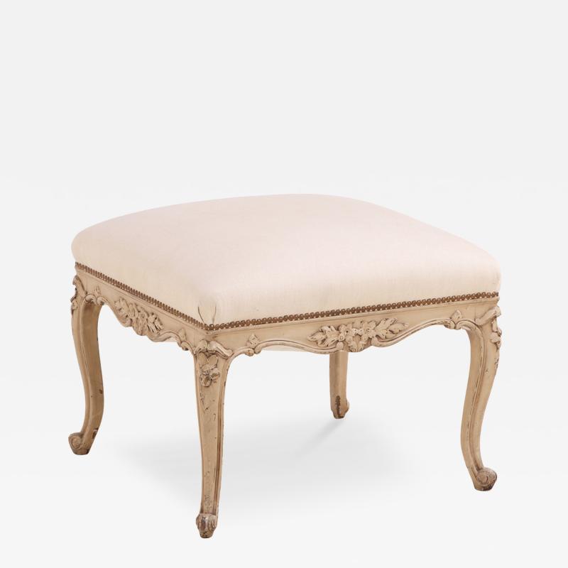 A French Louis XV style painted and carved wood upholstered stool C 1900 