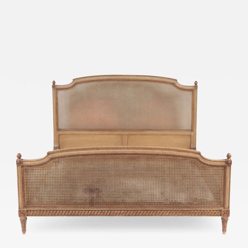 A French Louis XVI style Queen size bed with cane circa 1950