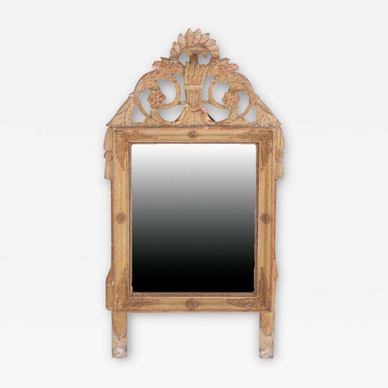 A French Louis XVI style carved and giltwood mirror early 19th C 