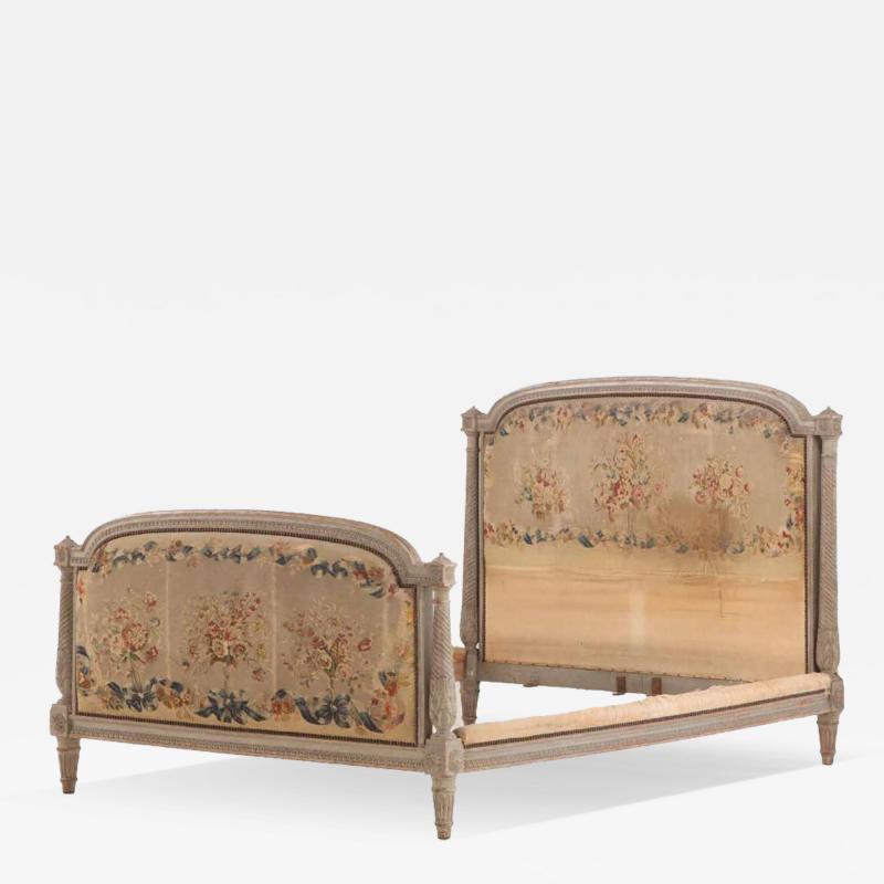 A French Louis XVI style carved and painted full size bed 19th C 
