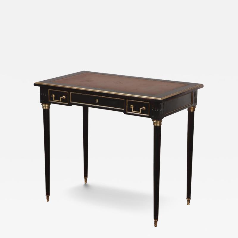 A French Louis XVI style ebonized mahogany leather top writing desk C 1940 