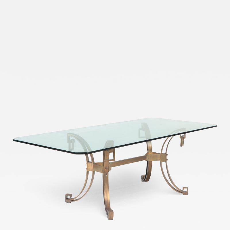 A French Modern Solid bronze dining table having a glass top C 1940 
