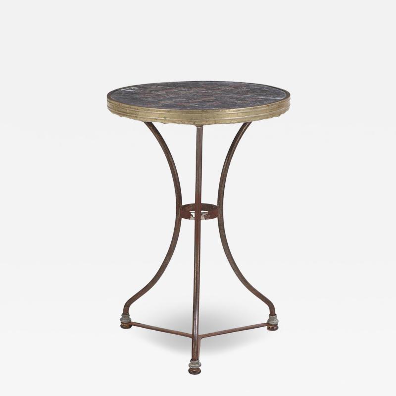 A French iron and brass marble top bistro table C 1900 