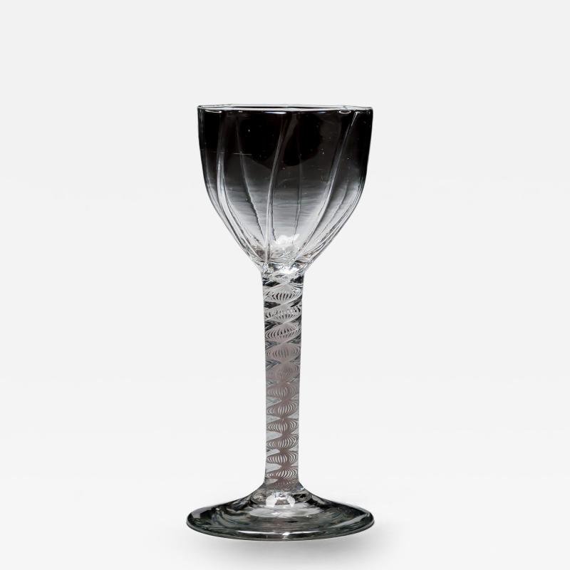 A GENEROUS PANEL MOULDED OPAQUE TWIST WINE GLASS