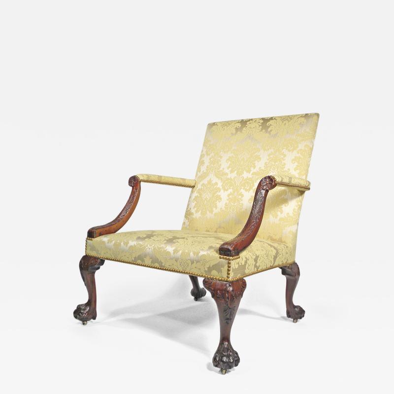 A GEORGE II STYLE MAHOGANY LIBRARY ARMCHAIR
