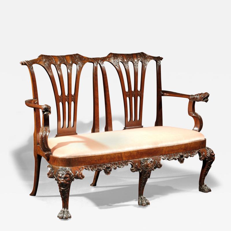 A GEORGE II WALNUT DOUBLE CHAIRBACK SETTEE