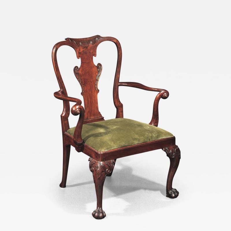 A GEORGE II WALNUT OPEN ARMCHAIR