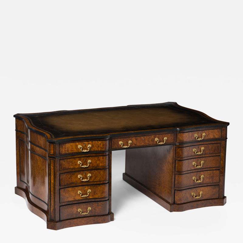 A GEORGE III STYLE BURR MAPLE PEDESTAL DESK