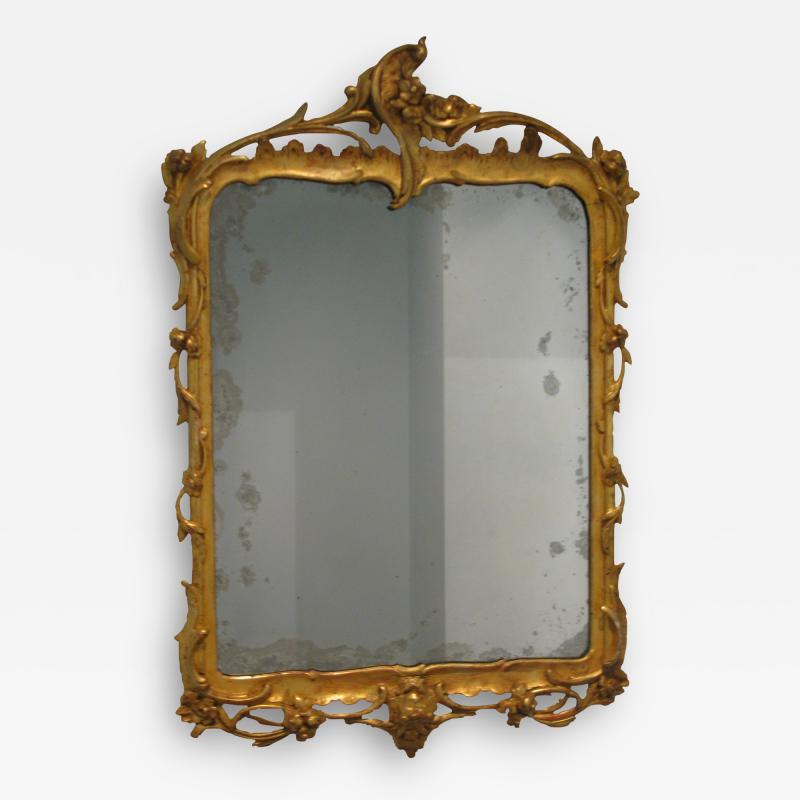 A German Carved and Gilded Openwork Wood Mirror with Original Glass