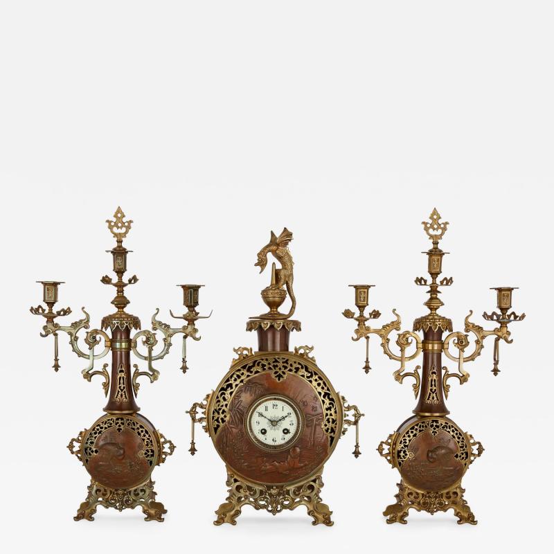 A Japonisme gilt bronze and brass three piece clock set