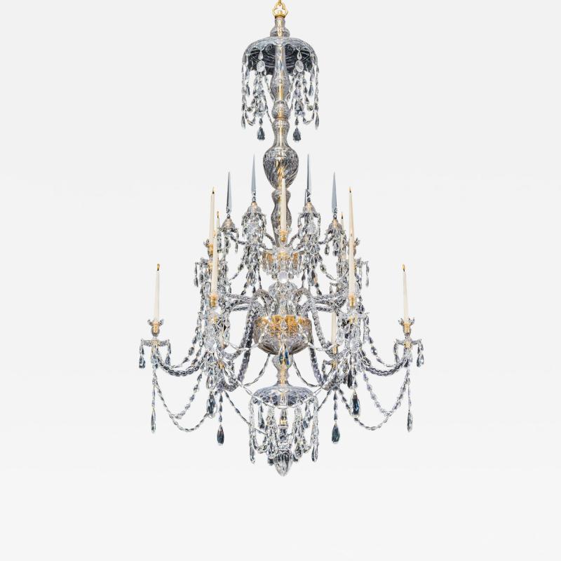 A LARGE GEORGE III STYLE 12 LIGHT CRYSTAL CHANDELIER