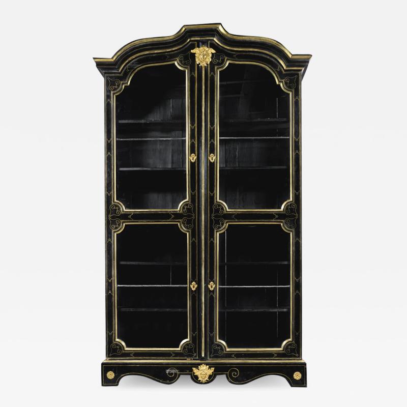 A LOUIS XIV ORMOLU MOUNTED AND BRASS INLAID EBONIZED BOOKCASE