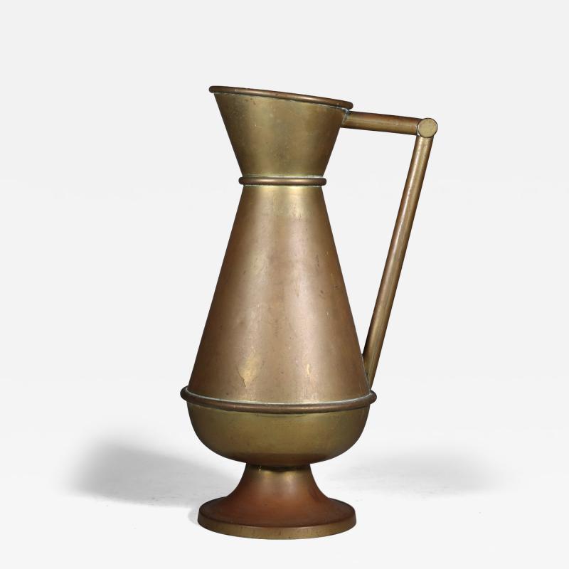 A Large Gothic Revival Heavy Brass Jug with a Simple Angular Form Handle