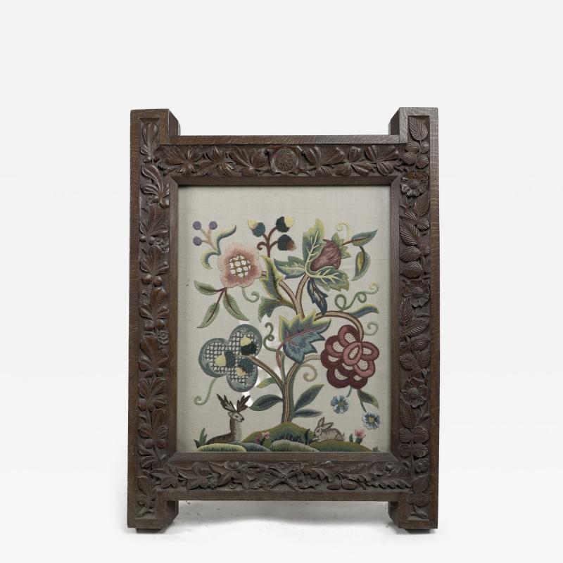 A Large Gothic Revival Picture Frame with Stylized Floral Carvings