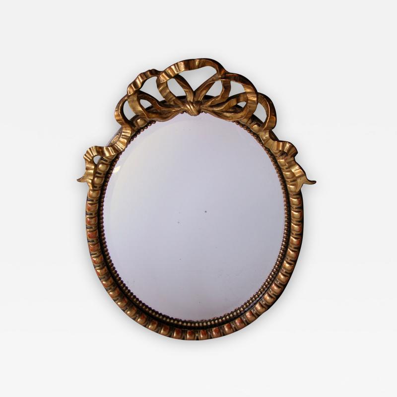 A Large Scaled Napoleon III Carved Oval Mirror