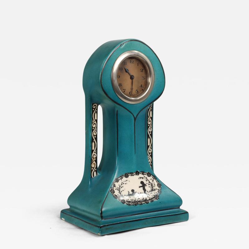A Little Turquoise Blue Dressing Table Clock Decorated with Cherubs by a Tree