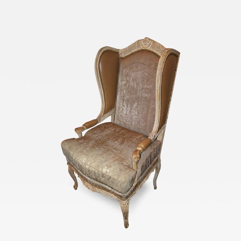 A Louis XV Fauteuil Polychrome Wing Chair 