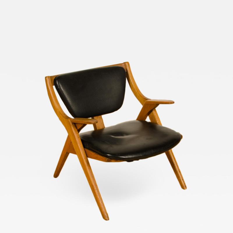 A Mid Century Modern teak lounge chair circa 1950