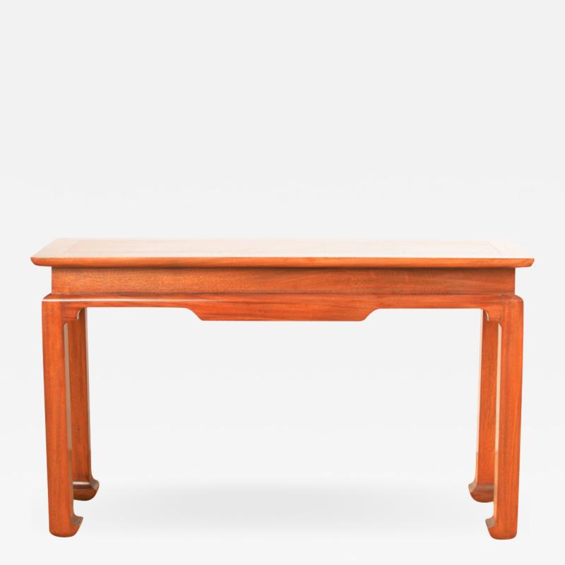 A Mid Century mahogany console in the manner of J Mont circa 1950 