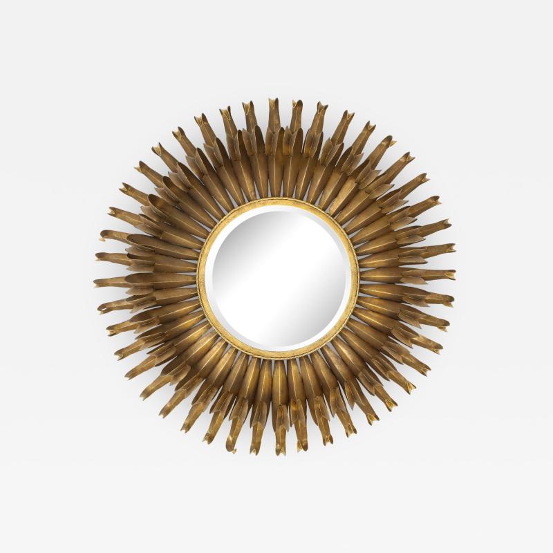 A Modernist round mirror sunburst pattern with central beveled round mirror 