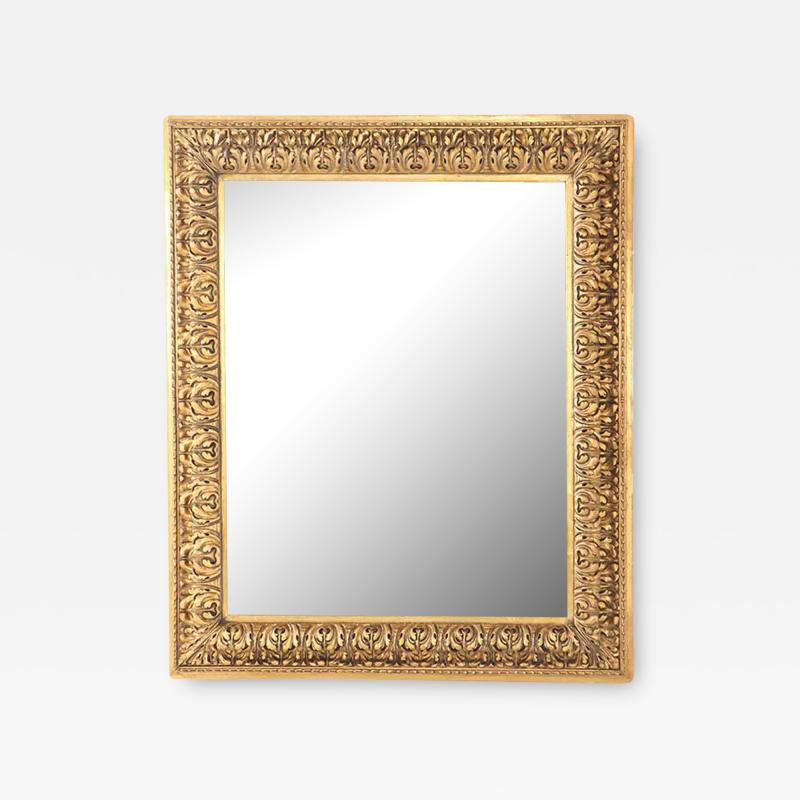 A Nineteenth Century continental relief and gilt carved mirror 