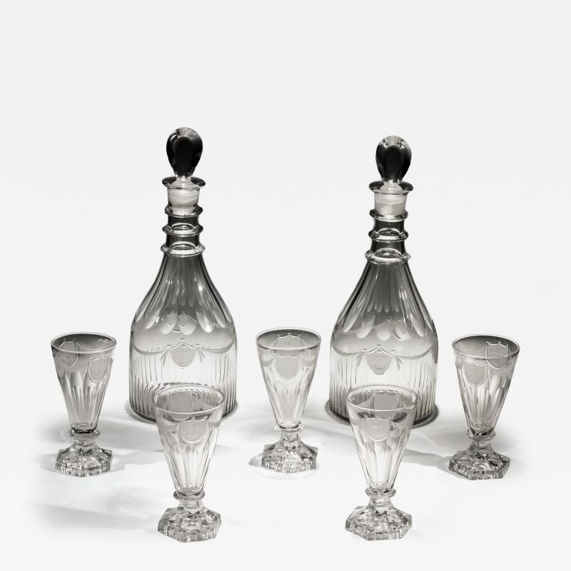 A PAIR OF DECANTERS OF NAUTICAL INTEREST WITH FIVE MATCHING GLASSES