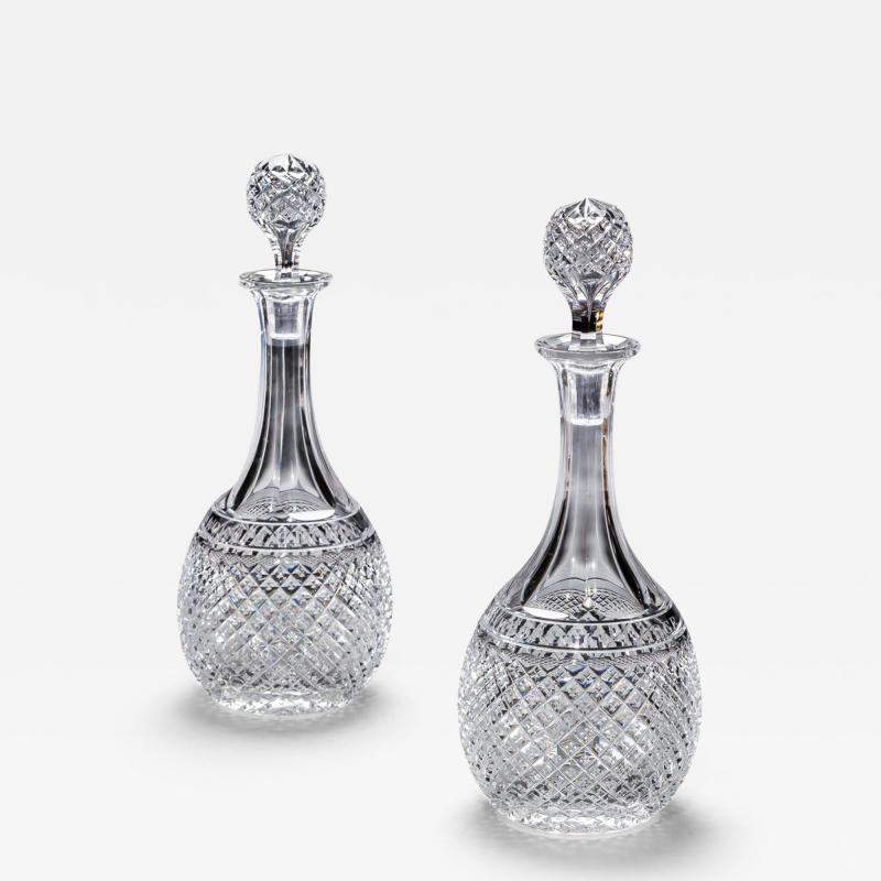 A PAIR OF ELABORATELY CUT DECANTERS OF MASONIC INTEREST