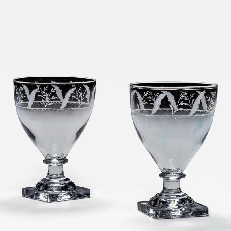 A PAIR OF ENGRAVED SQUARE BASE RUMMERS