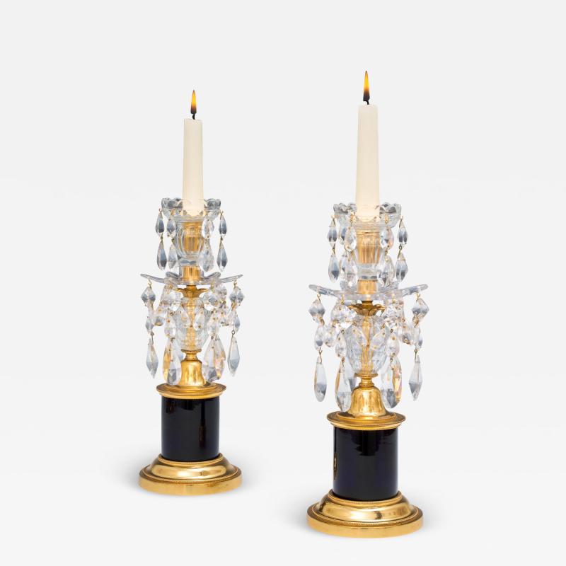 A PAIR OF GEORGE III CANDLESTICKS WITH BLUE DRUM BASES