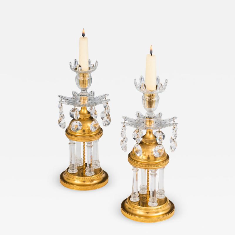 A PAIR OF GEORGE III TEMPLE CANDLESTICKS