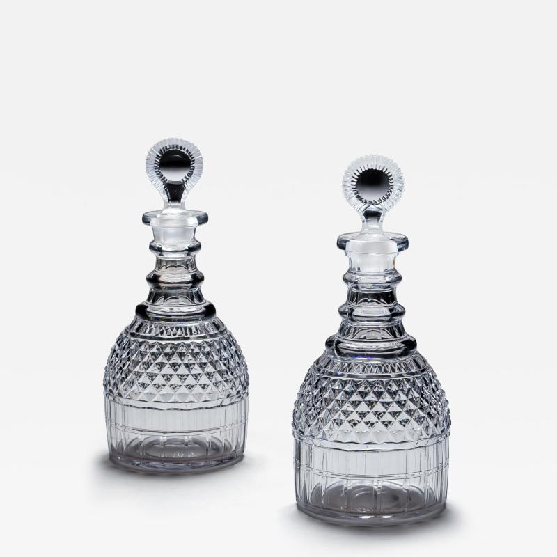 A PAIR OF REGENCY CUT GLASS DECANTERS