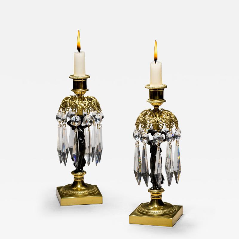A PAIR OF REGENCY GILT BRONZE FIGURE CANDLESTICKS