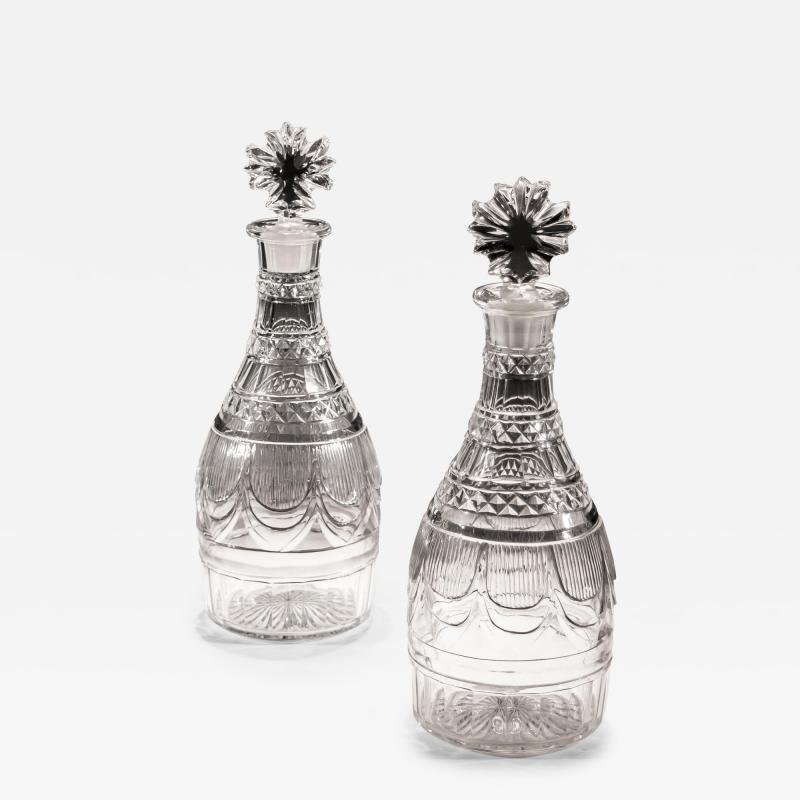 A PAIR OF RICHLY CUT REGENCY SPIRIT DECANTERS