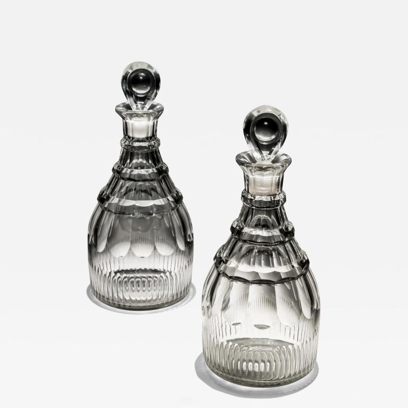 A PAIR OF SLICE FLUTE GEORGIAN DECANTERS WITH CUT RINGS