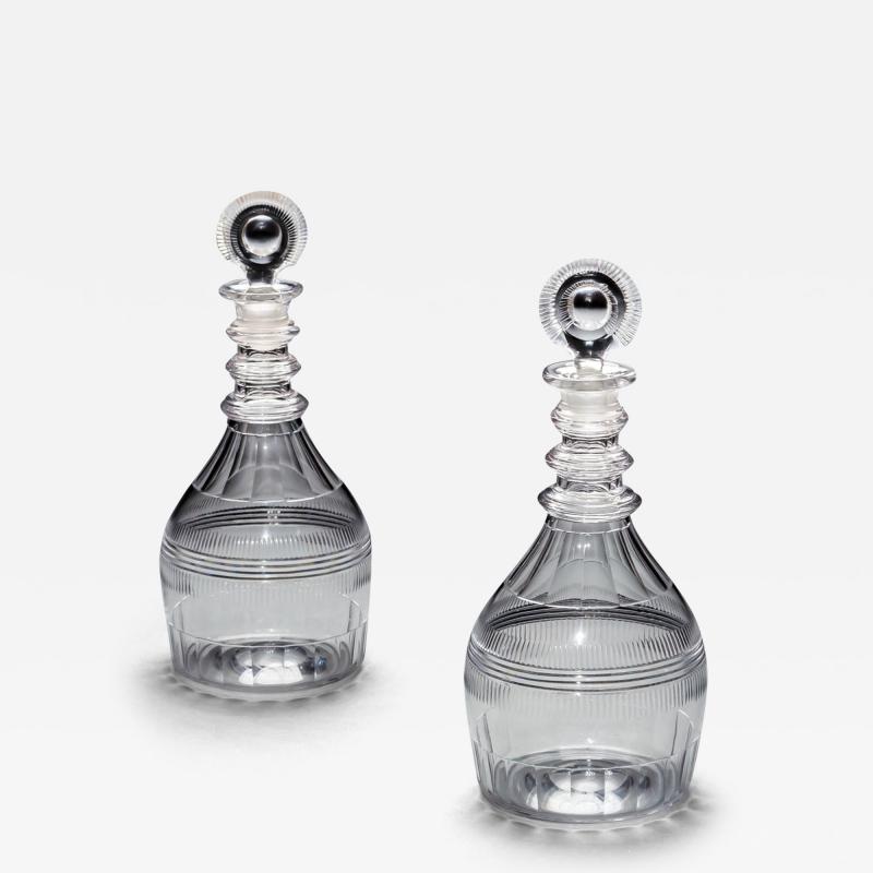 A PAIR OF TRIPLE RING REGENCY DECANTERS