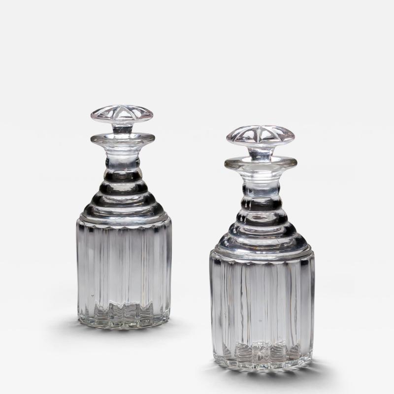 A PAIR OF WILLIAM IV PILLAR CUT DECANTERS