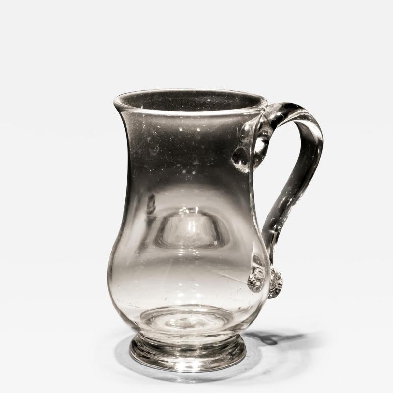 A PLAIN 18TH CENTURY GLASS MUG