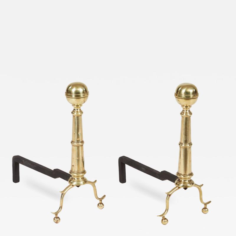 A Pair of Brass Ball Andirons on Cannon Barrel Shafts