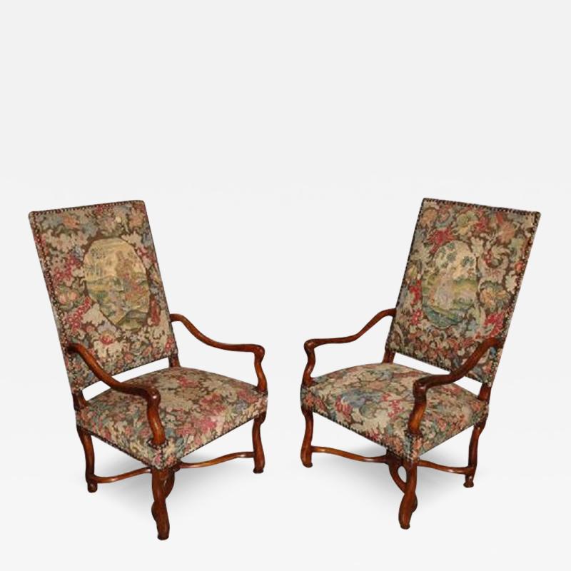 A Pair of Early 18th Century Louis XIV Transitional to R gence Walnut Fauteuils