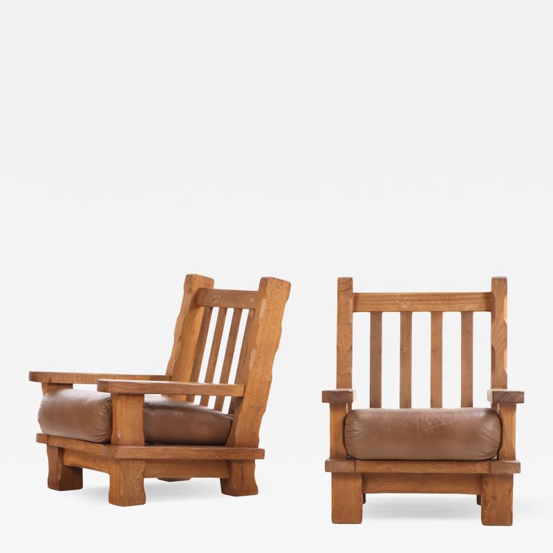 A Pair of French Heavy Oak Brutalist style Open Arm Chairs C 1960 