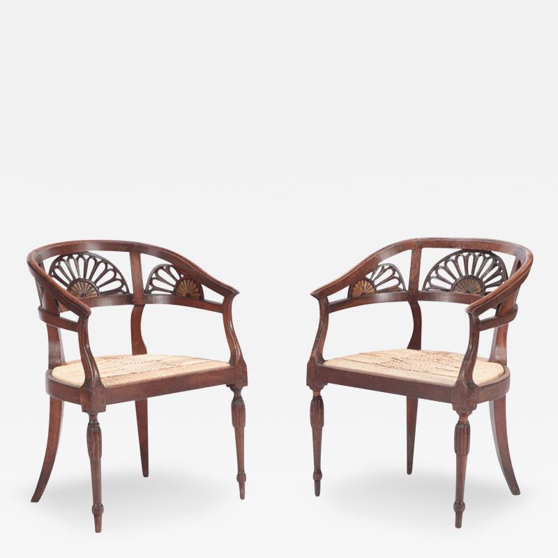 A Pair of Italian walnut open arm chairs with cord seats Circa 1800 